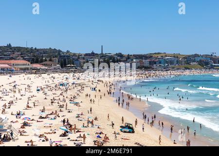 Summer 2023, Bondi Beach Sydney on a clear blue sky summers day, packed and crowded beach with people sunbathing and swimming,Sydney,NSW,Australia Stock Photo