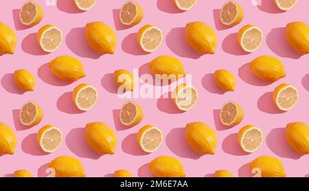 Seamless continuous pattern of yellow lemons on pink background. Minimalist concept of fresh citrus fruit Stock Photo