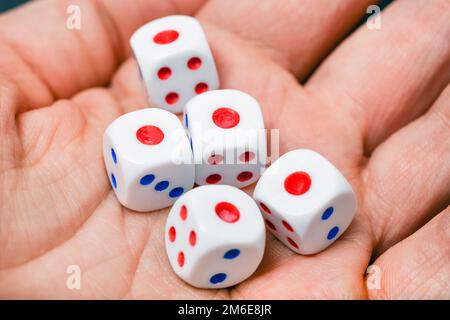 Close up view on dice on the palm. Yahtzee is a dice game. All five dice the same number - one. Stock Photo