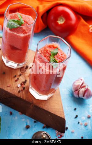 Classic spanish raw eating cold soup Gazpacho served  in glasses. food recipe. healthy concept. Stock Photo