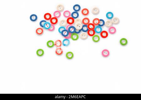 Pile of colorful buttons on white background Stock Photo