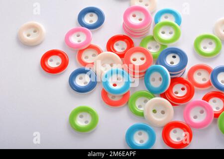 Pile of colorful buttons on white background Stock Photo