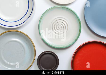 Various empty plates on white table, top view Stock Photo