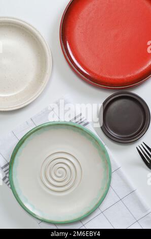 Different empty plates on white table, top view Stock Photo