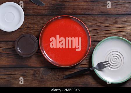 Various empty plates on dark wooden table, top view Stock Photo