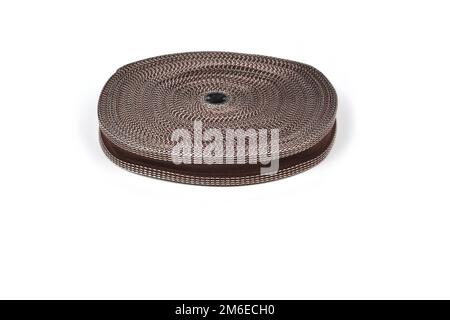 Stripe round bobbin cotton tape. strong braided webbing for making belts, on a white background. Stock Photo