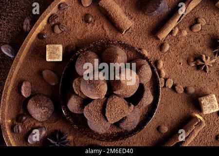 Healthy delicious chocolate truffles around ingridients with natural cocoa beans,  powder, cacao butter, cane sugar. healthy swe Stock Photo