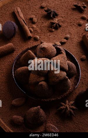 Healthy delicious chocolate truffles around ingridients with natural cocoa beans,  powder, cacao butter, cane sugar. healthy swe Stock Photo