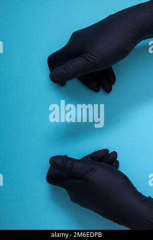 Hands in black nitrile gloves Stock Photo