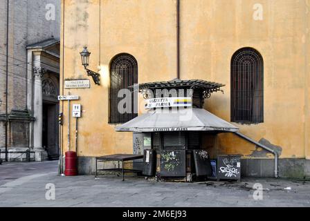 Closed newspaper kiosk in a deserted square near the church of the Steccata, Parma city center, Emilia Romagna region, Italy Stock Photo