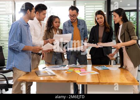 Interracial business team meeting smile and brainstorm Stock Photo