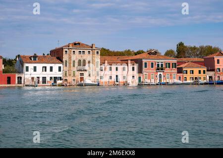 View of the colorful Venetian houses along the canal at the Islands of Murano in Venice Stock Photo