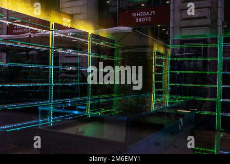 Vienna, Austria - October 14, 2022: Illuminated showcase of an empty store on a shopping street in Innere Stadt, Vienna, Austria Stock Photo