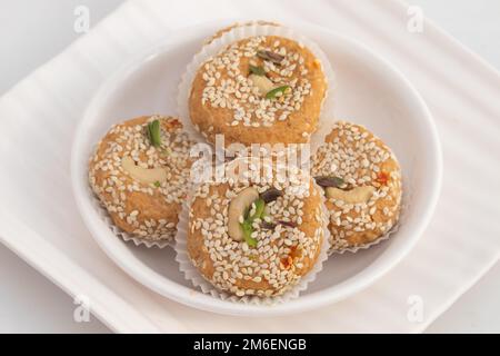 Winter Season Special Traditional Punjabi Mithai Til Tikki Or Tilkut Gud Mawa Bati Is Made Of Dry Roasted Sesame Seeds With Mava, Khoya, Jaggery, Gur, Stock Photo