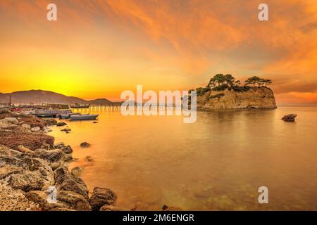 The sunrise at Agios Sostis Island  (Cameo) in Zakynthos, Greece Stock Photo