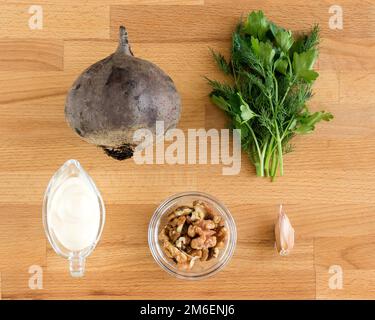 Ingredients for making beetroot and nut salad. View from above Stock Photo