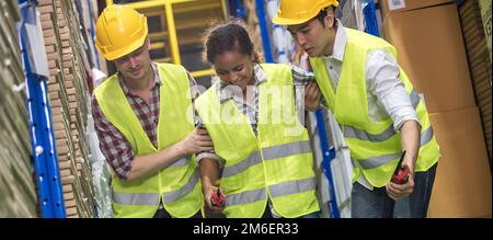 Warehouse worker help colleague first aid after accident panorama Stock Photo