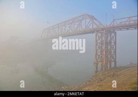 Non Exclusive: 04 January 2023 In Sylhet-Bangladesh: Keen Bridge in Sylhet in deep foggy winter morning in Sylhet, Bangladesh. Cold wave is blowing ac Stock Photo