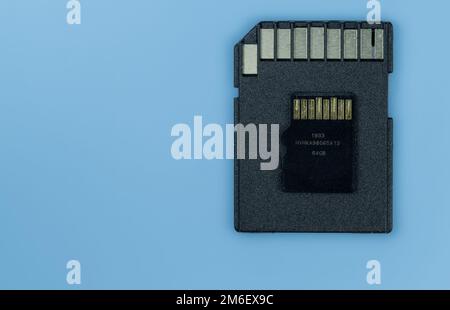 A sd memory card and micro sd on blue background Stock Photo
