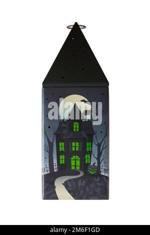 Halloween tin isolated on white background - all butter biscuit light up lantern with a creepy green LED tea light from M&S Stock Photo