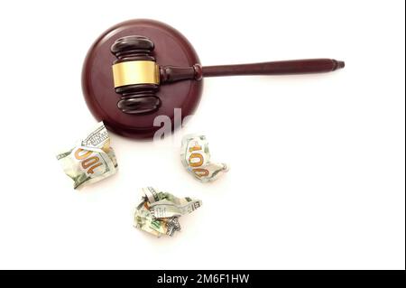 Legal gavel with crumpled hundred dollar bills isolated on white background Stock Photo