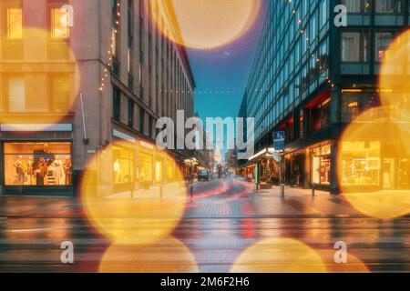 Helsinki, Finland. Effect Bokeh Abstract Bright Blue Sky. New Year Lights Xmas Christmas Decorations And Festive Illumination. Winter Christmas Stock Photo