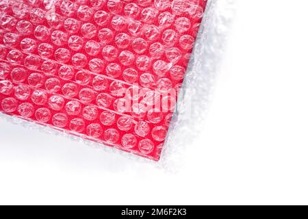 The red box is wrapped in a transparent bag with vacuum bubbles Stock Photo