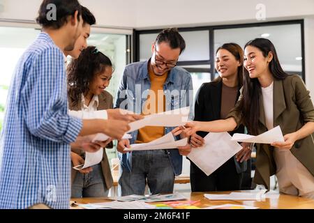Interracial business team meeting smile and brainstorm Stock Photo