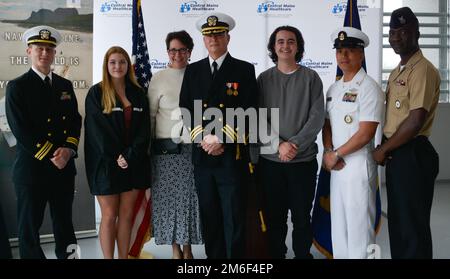 Cmdr. King poses for a photo with his family in Lewiston, Maine. Dr. Richard King is newly commissioned as Cmdr. Richard King in a commissioning ceremony. Stock Photo