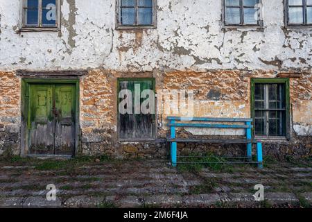 Old door and window on the old wall brick Stock Photo
