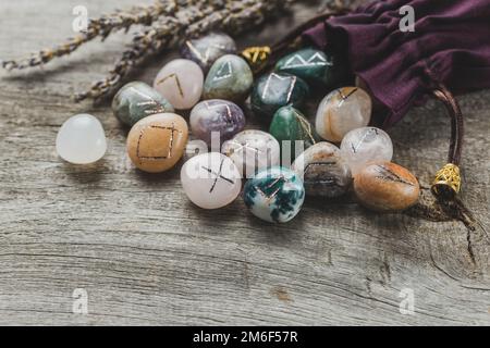 Natural Rune Shell Green quartz stones are scattered on small pebbles with shells vertical ...