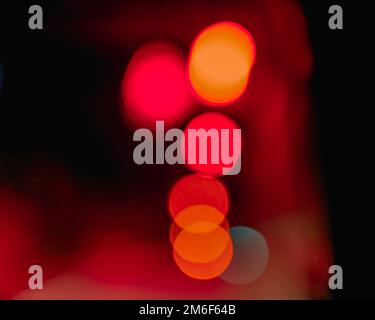 Beautiful bokeh colorful background.Long exposure light painting,orange vibrant neon.Blue,red,orange bokeh. designed background. Modern background. Stock Photo