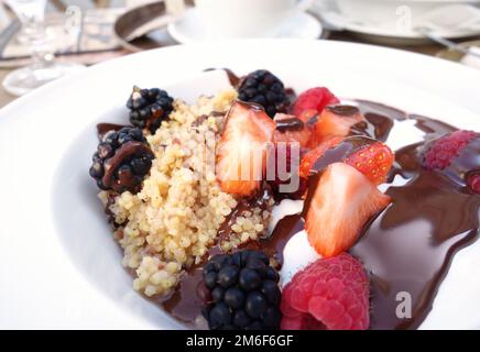 Bowl of hot porridge breakfast cereal with fresh fruit Stock Photo