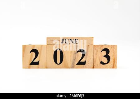 June 2023 written on wooden blocks isolated on white background with copy space. Stock Photo