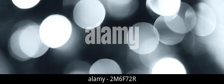 Blurred lights, gray, deep blue background, banner texture. Abstract bokeh with soft light header. Wide screen wallpaper. Panoramic web banner with co Stock Photo