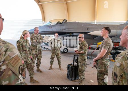 Members of the 179th Expeditionary Fighter Squadron watch as an ...