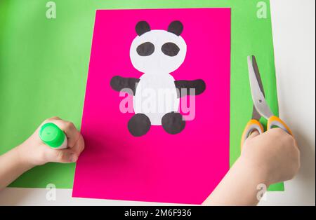 Paper crafts for children. Application of children's creativity.  Kindergarten and craft school. On a beige background, a funny face of a man  made of colored paper. 18906892 Stock Photo at Vecteezy