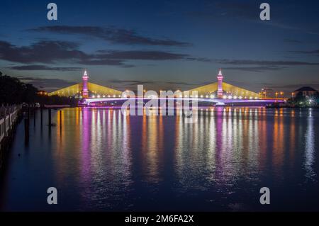 Bridge over the Chao Phraya River, turn on the LED lights at dusk. Stock Photo