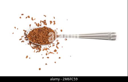 Spoon with instant coffee granules on a white background Stock Photo