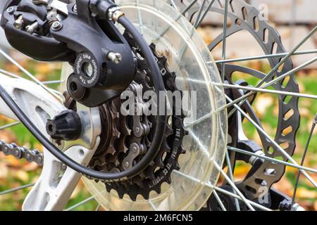 Dirty bicycle drivetrain. Gravel Bike Transmission in Mud. Dirty Chain Drive of Mountain Bike After Riding in Bad Weather. Concept of bike service aft Stock Photo