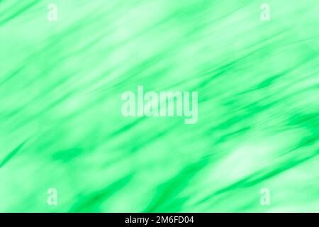Abstract swirl blurry effect green background. Radial motion abstract green background. Stock Photo