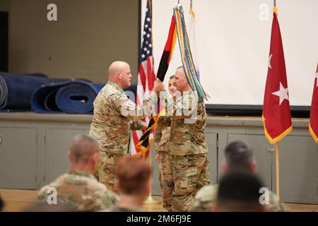 During the 78th Training Division's Assumption of Command Ceremony, Army Reserve Brig. Gen Christopher W. Cook passes the colors to Army Reserve Command Sgt. Maj. John R. Hilton at Muscatatuk Urban Training Center, IN April 27, 2022. Stock Photo