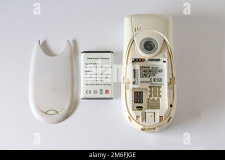A vintage deconstructed Nokia 3650 GSM phone on a white surface Stock Photo