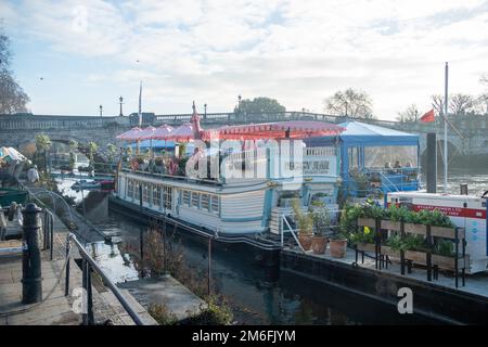 London- December 2022: The Peggy Jean boat restaurant by Richmond Bridge over the River Thames in south West London Stock Photo