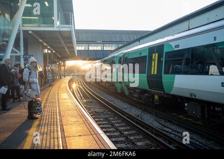 London-December 2022: Southern Train aClapham Junction Station platform- interchange National Rail and London underground station in south west London Stock Photo