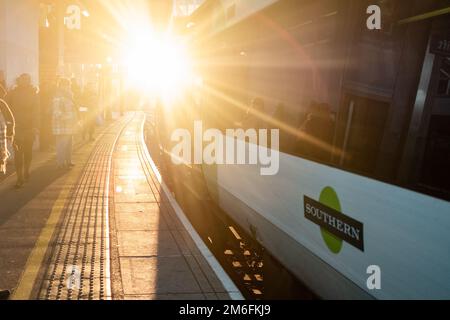 London-December 2022: Southern Train aClapham Junction Station platform- interchange National Rail and London underground station in south west London Stock Photo