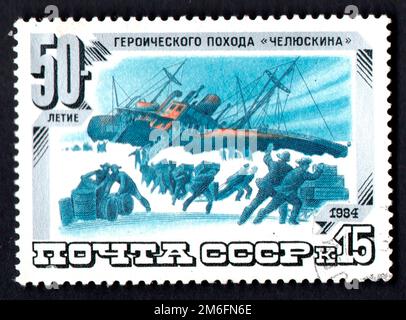 USSR - CIRCA 1984: USSR postage stamp dedicated to heroic campaign of motor ship Chelyuskin. Steamer Stock Photo