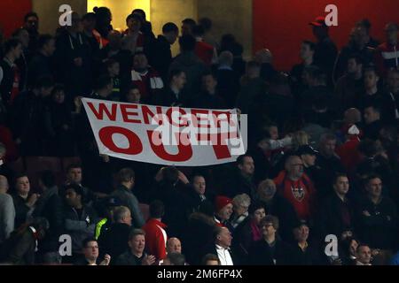 Arsenal fans hold up a banner declaring Manager of Arsenal, Arsene Wenger out - Arsenal v Lincoln City, The Emirates FA Cup Quarter-final, Emirates Stadium, London - 11th March 2017. Stock Photo