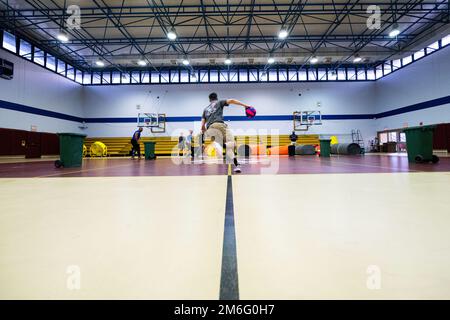 Airmen from across the 39th Air Base Wing participate in a performance by members of the athletic competition television show, “American Gladiators”, at Incirlik Air Base, Turkey, April 27, 2022. Cast members of “American Gladiators” visited Incirlik AB to show support of base members serving in overseas locations and thank them for their unwavering dedication to defending NATO’s southern flank. Stock Photo