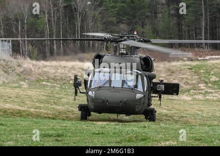 A UH-60M Black Hawk helicopter Prepares to take off during the aerial gunnery training conducted by the 3rd Battalion, 142nd Aviation Regiment of the New York National Guard at Fort Drum, NY  on April 27, 2022 . The   door gunners practiced engaging targets on the ground during the battalions  April 23- May 7 annual training period. The battalion is preparing to mobilize and deploy to Kuwait in June. Stock Photo
